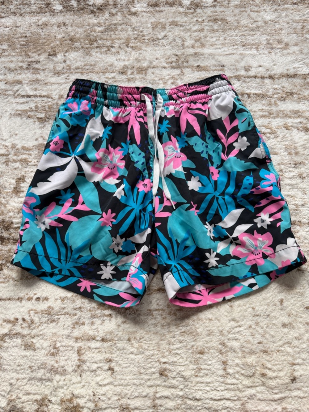 Chubbies Black/Pink/White/Blue Swim Shorts with Tropical Print. Size: S - 5.5ins